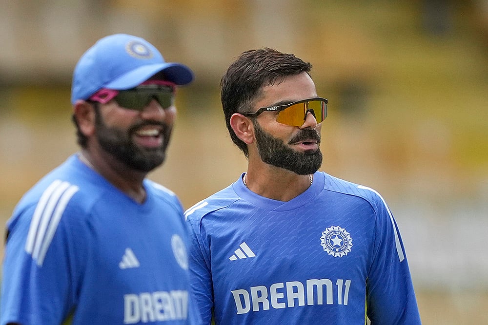 | Photo: PTI/Kunal Patil : IND vs SL, 1st ODI: Rohit Sharma and Virat Kohli during the training session.